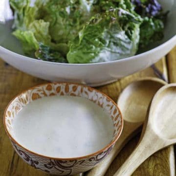Creamy Japanese Salad Dressing in a small bowl in front of a bowl of lettuce.