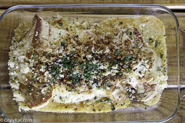 Homemade Longhorn Steakhouse Parmesan Crusted chicken in a baking dish.