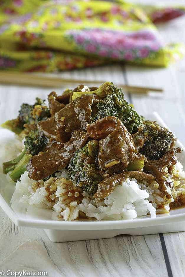 Homemade copycat Panda Express Broccoli Beef and rice on a white plate.