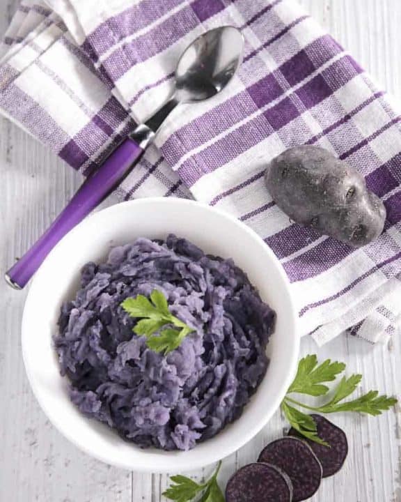 a bowl of purple mashed potatoes