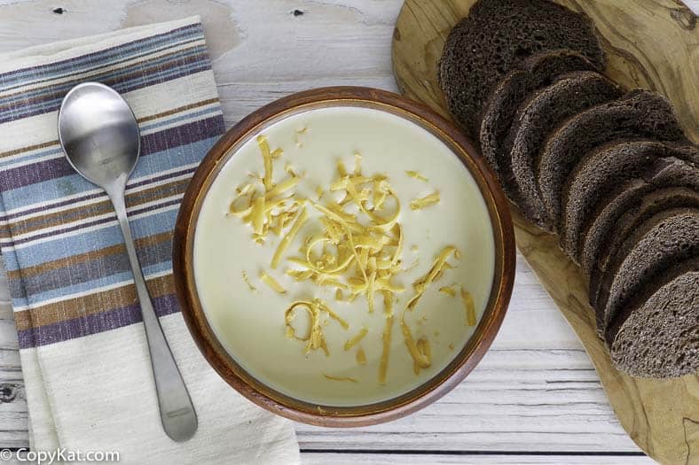 Homemade copycat Outback Steakhouse Walkabout Soup in a bowl next to sliced bread.