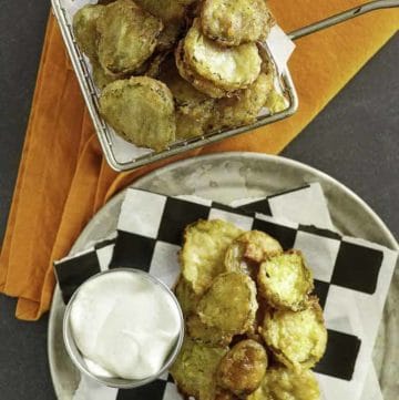 fried pickles in a fry basket and on a plate