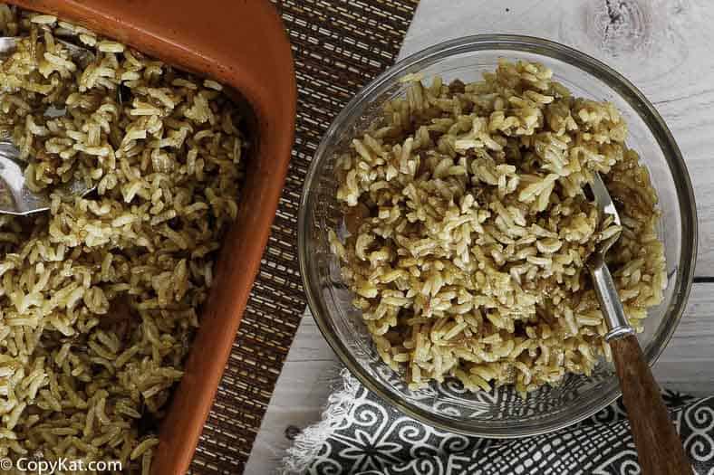 Stick of butter rice in a bowl and baking dish.