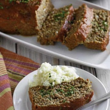 Homemade Boston Market Meatloaf on a plate and serving dish.