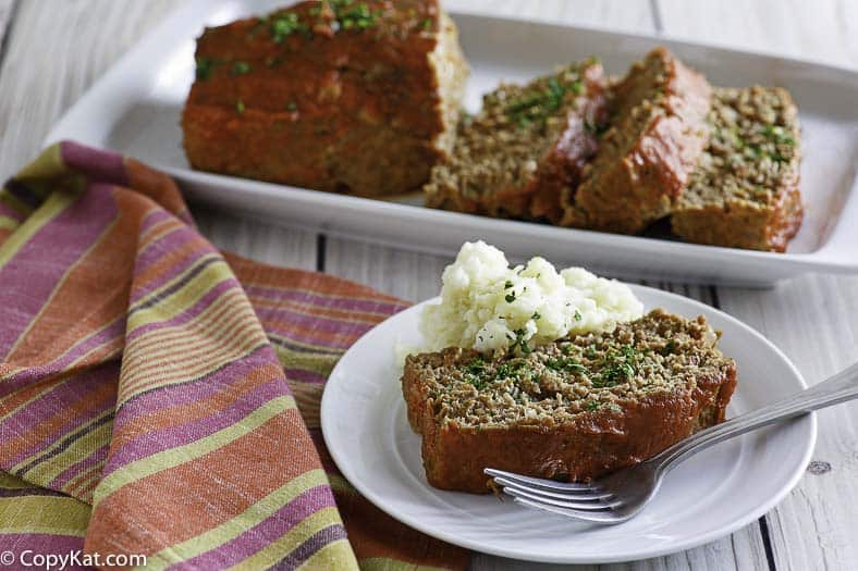 Homemade Boston Market Meatloaf and mashed potatoes on a plate.