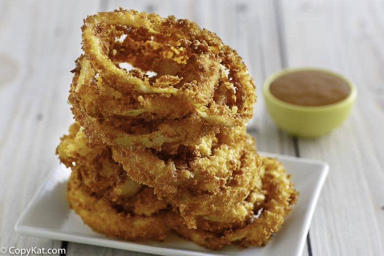 Homemade copycat Red Robin Onion Rings on a white plate.