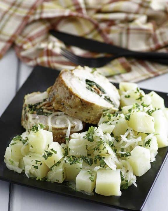 Buttery Parsley Potatoes and chicken on a plate.