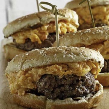 Burgers topped with pimento cheese spread.
