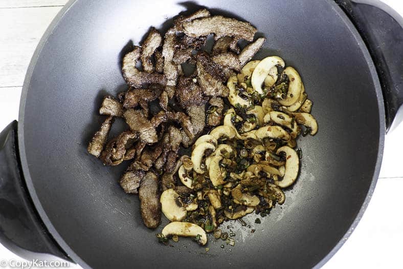 Mongolian Beef being cooked in a wok