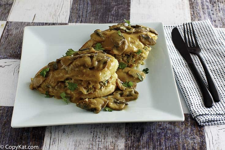 Homemade Olive Garden Stuffed Chicken Marsala on a square plate.