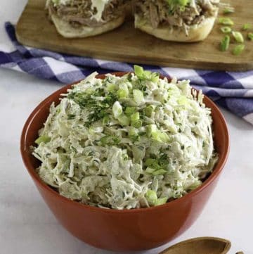 Homemade Houston's coleslaw in a bowl and on pork sandwiches