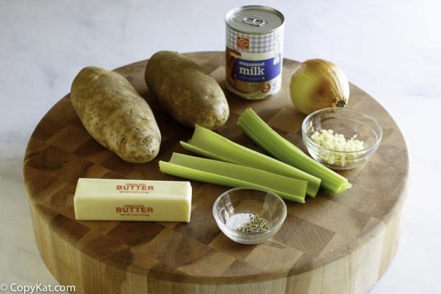 Ingredients for potato soup: potatoes, celery, evaporated milk, butter, garlic, and seasonings.