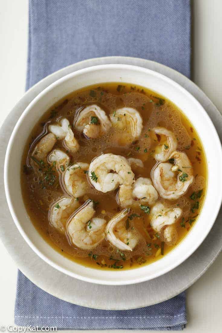 Shrimp cooked in a spicy broth in a bowl. 