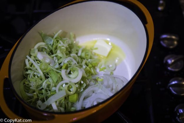 Sauteeing leeks and onions in butter.