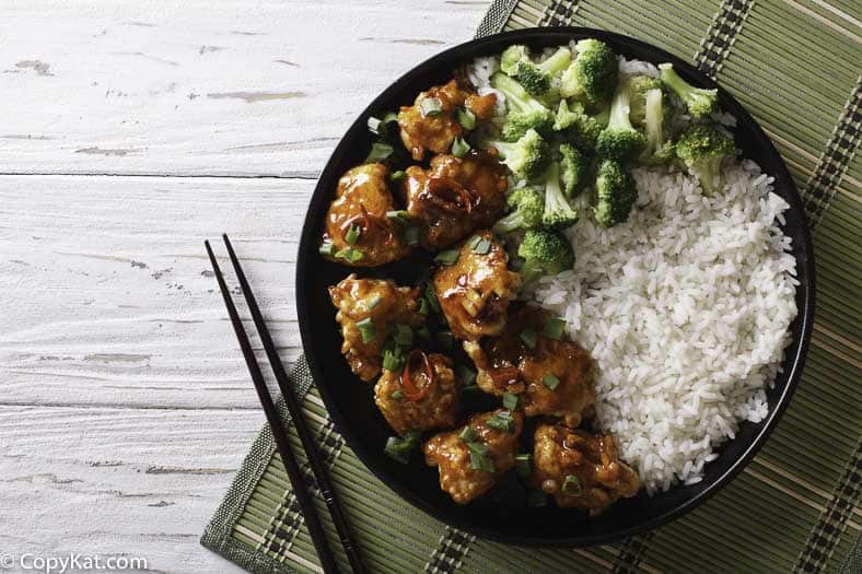 A plate of homemade General Tso's Chicken with rice and broccoli
