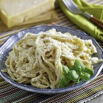 A bowl of pasta with homemade Olive Garden Alfredo sauce.