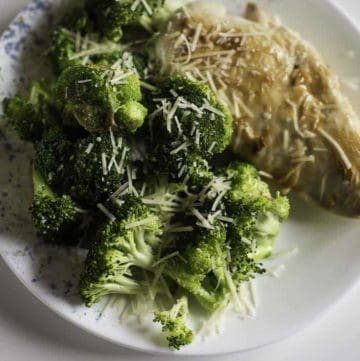 Chicken with broccoli topped with Parmesan cheese
