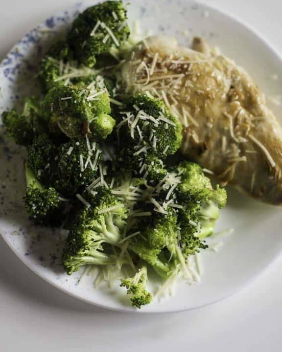 Chicken with broccoli topped with Parmesan cheese