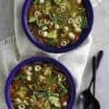 Two bowls of homemade Olive Garden minestrone soup, full of fresh vegetables and pasta