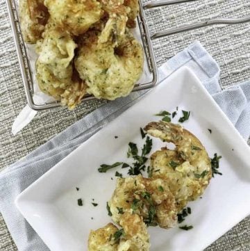 A basket and a plate of homemade shrimp tempura