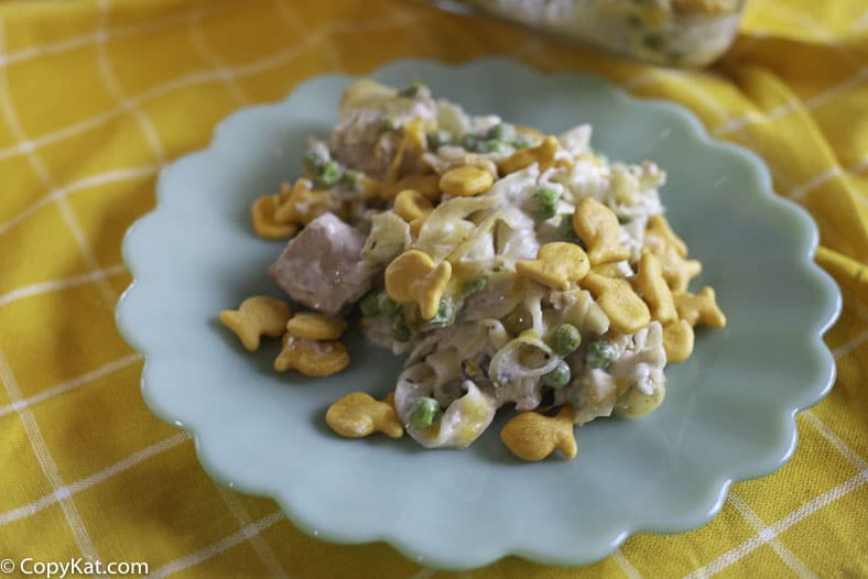 A plate of tuna noodle casserole that is super cheesy