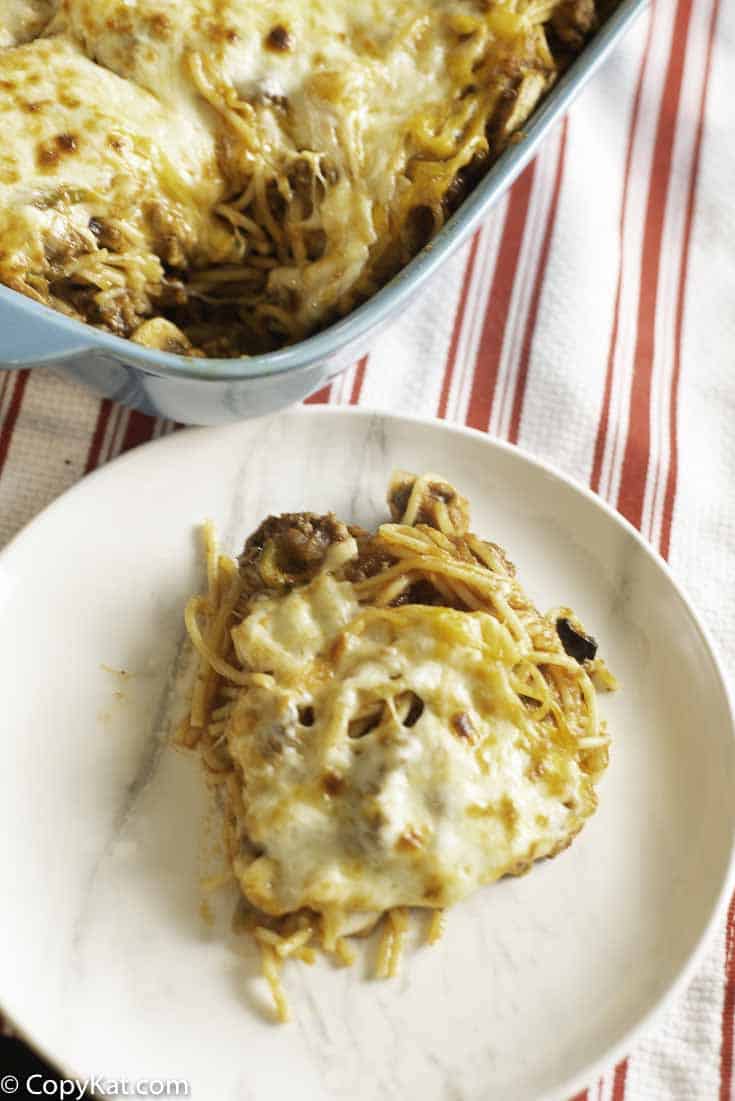 a cheesy spaghetti casserole with onions, peppers, mushrooms, and more. 