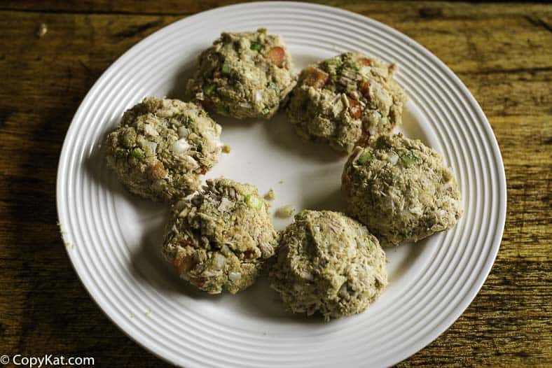 uncooked tuna patties on a plate 