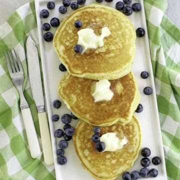 buttermilk pancakes with butter and fresh blueberries