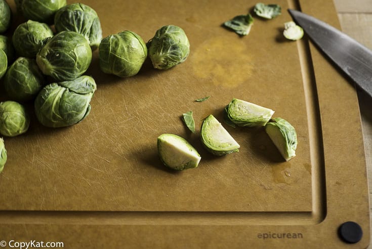 Brussel Sprouts being cut into quarters