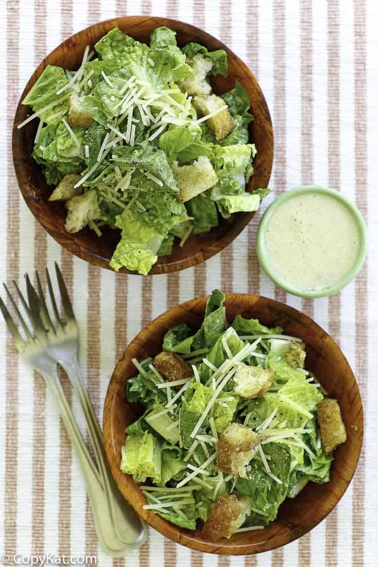 Homemade copycat Outback Steakhouse caesar salad dressing and two small bowls of salad