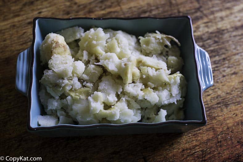 baked potato flesh in a blue dish