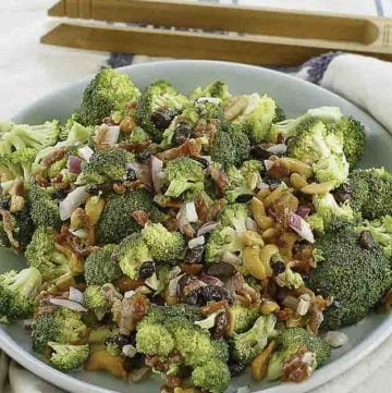 broccoli salad with nuts and a sweet dressing in bowl