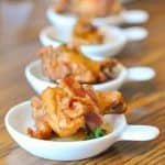 Honey Habanero Chicken Wings in small appetizer bowls.