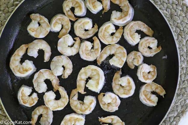 cooking the shrimp in a skillet