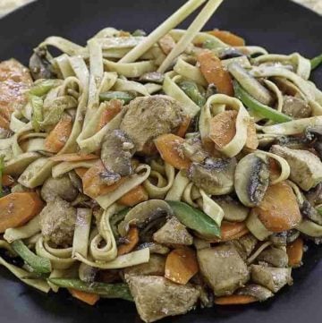 a plate of chicken lo mein made at home