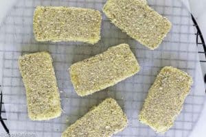 breaded cheese slices on a wire rack.