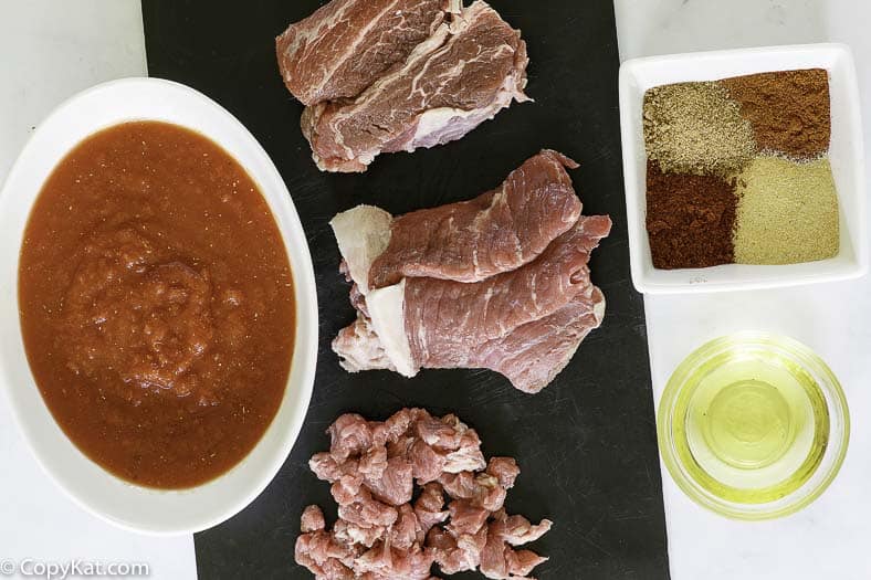 chuck roast, tomato sauces, and spices to make a bowl of chili