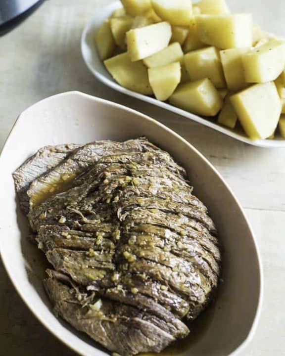 a perfectly seasoned and tender roast beef cooked in a pressure cooker