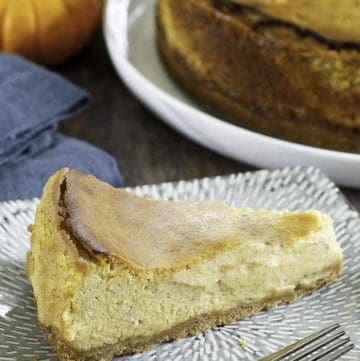 a slice if pumpkin cheesecake on a plate