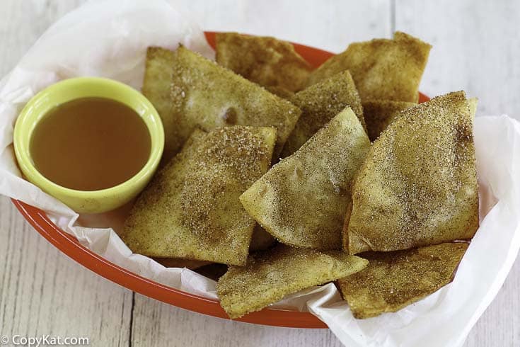 cinnamon sugar tortilla chips and honey in a basket