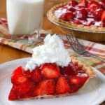 a slice of fresh strawberry pie on a plate