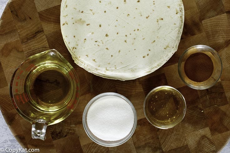 tortillas, cinnamon, sugar, honey, and oil to make bunuelos like taco bell are pictured 