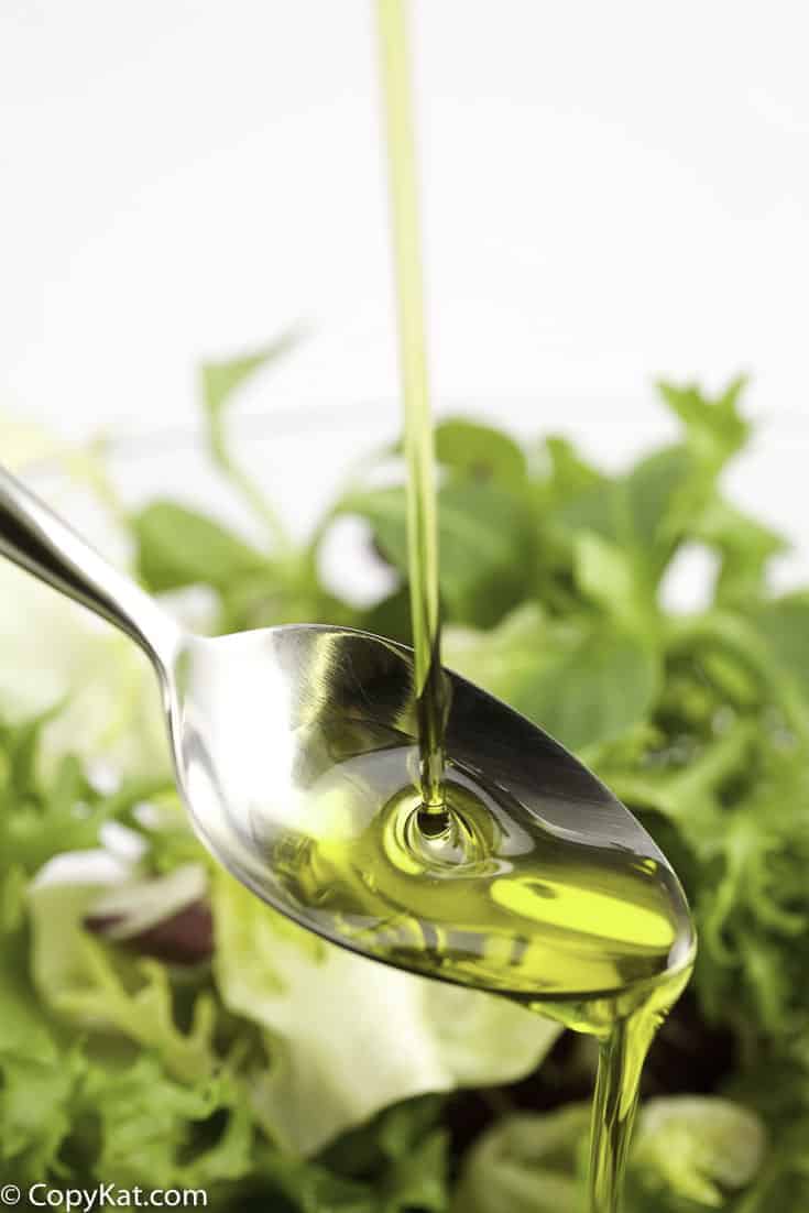 vegetable oil poured over a salad