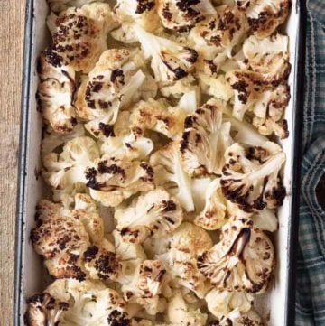 oven roasted cauliflower in a baking dish