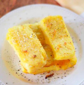 fried cornmeal mush on a white plate