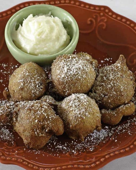 Denny's Strawberry Pancake Puppies on a plate with dipping sauce