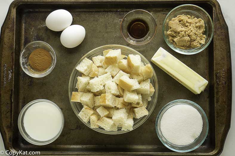 Bread, sugar, butter, and more to make bread pudding.