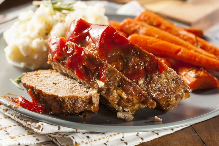 meatloaf, carrots, and mashed potatoes on a grey plate