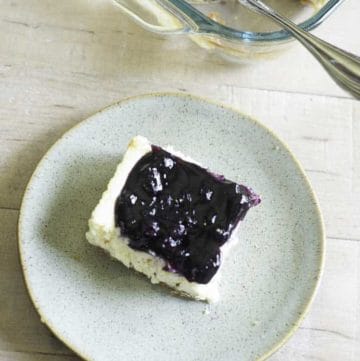 a piece of a blueberry cheesecake bar