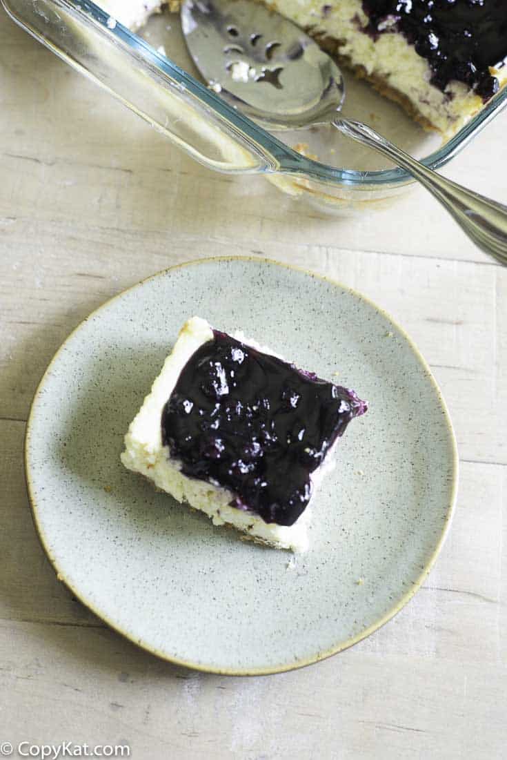 a piece of a blueberry cheesecake bar 